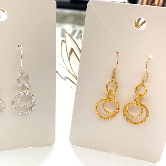 Silver and gold sparkly dangle earrings. - Picture 2 of 2